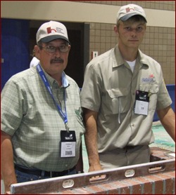 Instructor Charles West (left) with Bradley Wright (right) pose with Wright's winning composite project in the 2009 SkillsUSA national masonry contest.