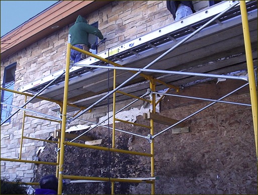 Stone veneer removal on home with entrapped moisture damage to rainscreen building envelope