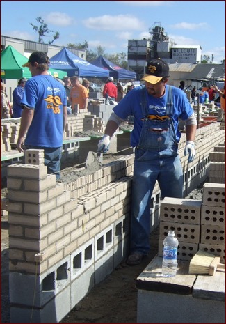 Mayes participates in a bricklaying competition.