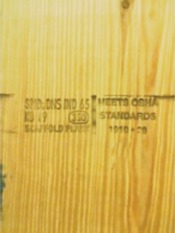 Solid sawn scaffold plank that has of mill/grade stamp and OSHA-compliant stamp.