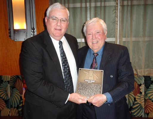 MCAA Chairman John Smith (left) presents Donald Grant with the Masonry Hall of Fame plaque.