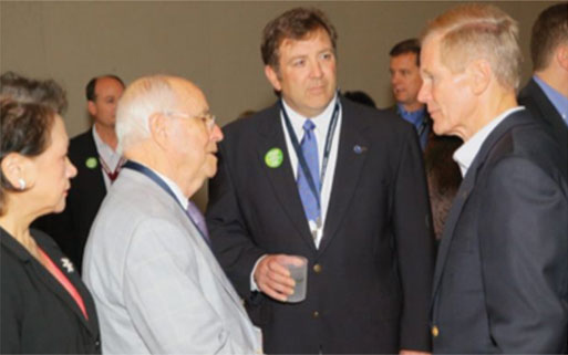 Shown is Major Ogilvie (center) introducing Sen. Bill Nelson (right) to Charles Newsome with Johnson Concrete Co. on The Hill in 2012.