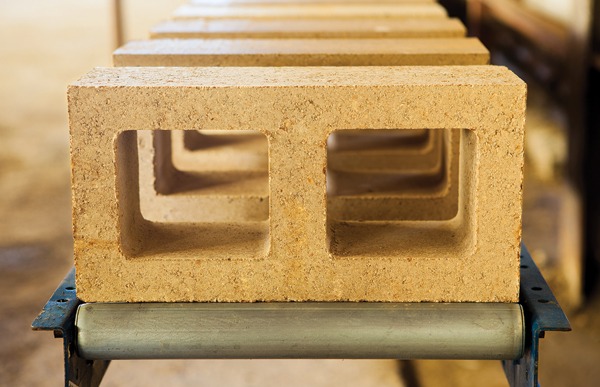  First generation Watershed Block made with half the cement of traditional concrete block and incorporating locally sourced, often recycled or repurposed unwashed aggregate. Watershed Block are engineered to meet ASTM-C90 requirements for concrete block. Image credit: ©Jacob Snavely