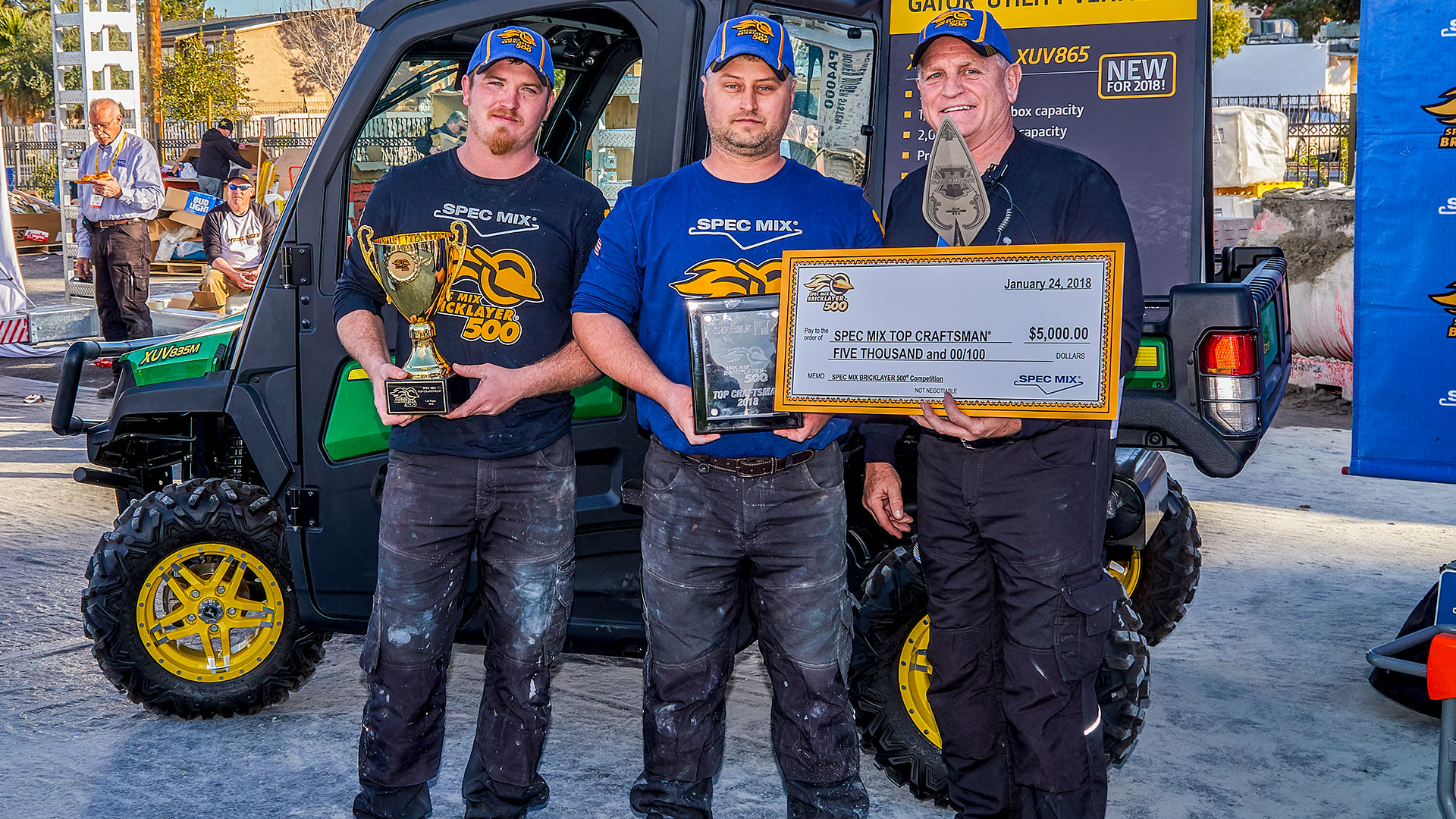 SPEC MIX TOP CRAFTSMAN&reg; winner Leif Reints (middle) and his mason tender Michael Weisinger (left) pose with emcee Jim O’Connor of the Greater Chicago Mason Contractor Association.